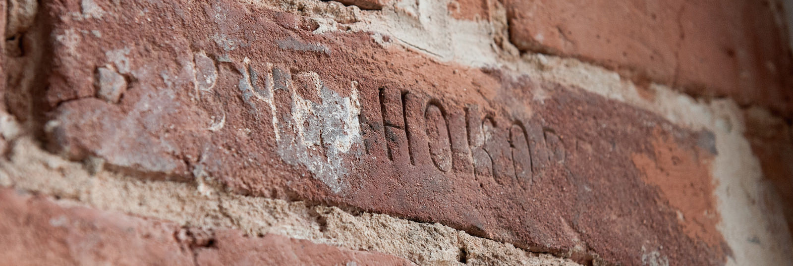 Brick with ‘V. Chelnokov’ stamp on the second-floor wall of the building. The Chelnokov Brick Factory was one of the largest in the late 19th century